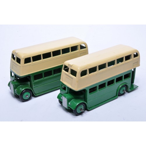 661 - Dinky No. 29c Double Decker Bus. Duo of issues in green (inc hubs) and cream as shown (note baseplat... 