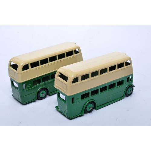 661 - Dinky No. 29c Double Decker Bus. Duo of issues in green (inc hubs) and cream as shown (note baseplat... 