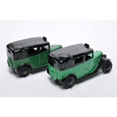 693 - Dinky No. 36g Taxi. Duo of issues in green as shown (note shade variation). Both display generally v... 