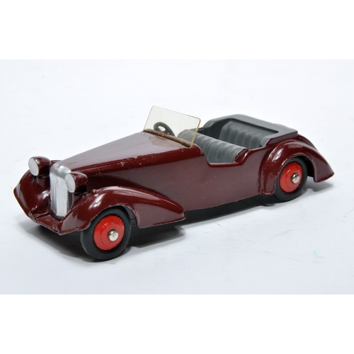 705 - Dinky No. 38d Alvis. Single issue is in maroon with dark grey interior, as shown. Displays generally... 