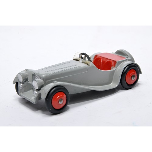 710 - Dinky No. 38f Jaguar SS. Single issue is in grey with red interior inc hubs, as shown. Displays gene... 