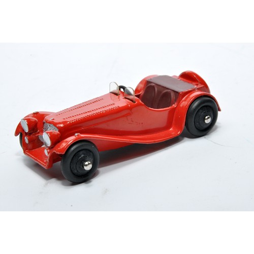 713 - Dinky No. 38f Jaguar SS. Single issue is in red with maroon interior, as shown. Displays generally v... 