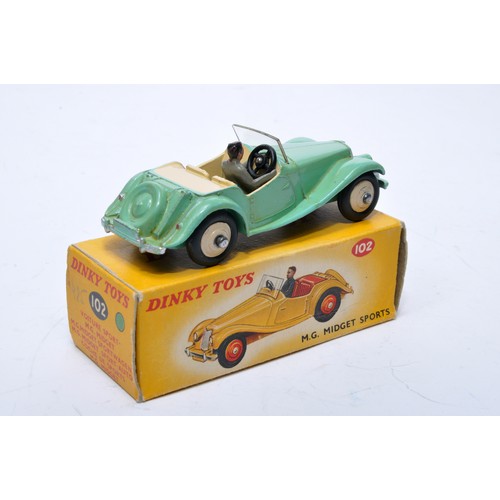 758 - Dinky No. 102 MG Midget Sports. Single issue is in mint green, with cream interior, cream hubs, plus... 