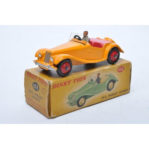 759 - Dinky No. 102 MG Midget Sports. Single issue is in deep yellow, with red interior, red hubs, plus dr... 