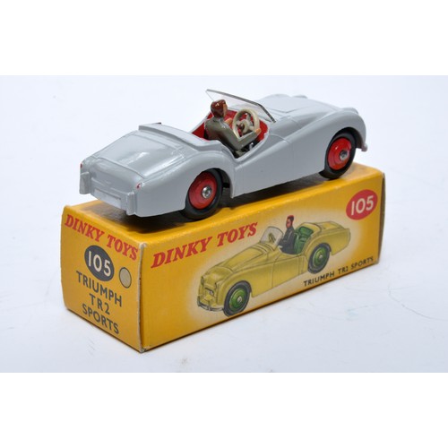 764 - Dinky No. 105 Triumph TR2 Sports. Single issue is in grey, with red interior, red hubs, plus driver,... 