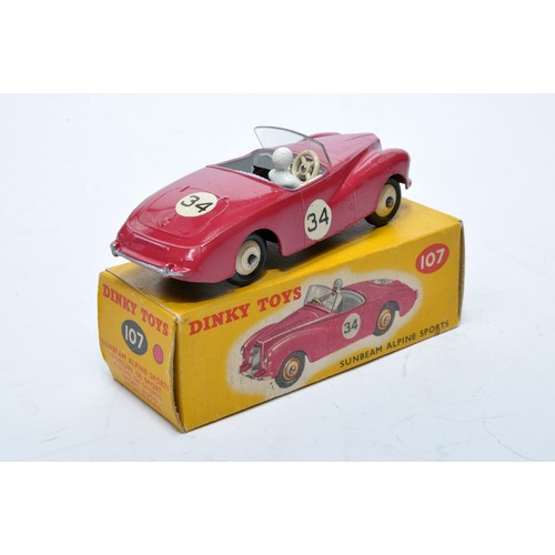 769 - Dinky No. 107 Sunbeam Alpine Sports. Single issue is in cerise, RN34 with grey interior, and cream h... 