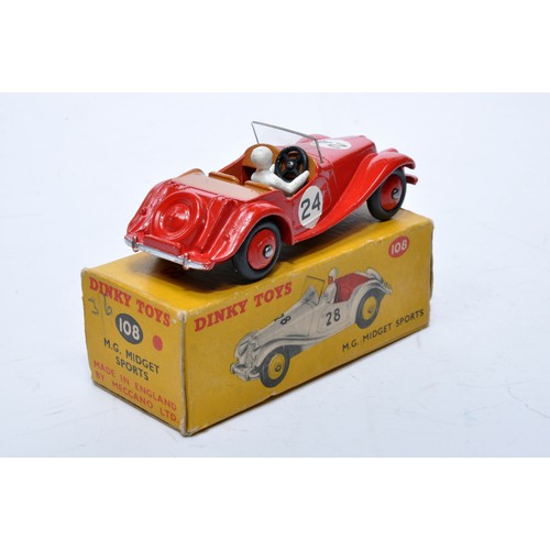 770 - Dinky No. 108 MG Midget Sports. Single issue is in red, RN24 with brown interior, and red hubs, as s... 