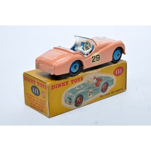 777 - Dinky No. 111 Triumph TR2 Sports. Single issue is in pink, RN29 with blue interior, and blue hubs, a... 