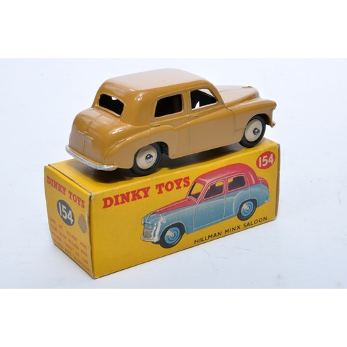 791 - Dinky No. 154 Hillman Minx Saloon. Single issue is in tan, with fawn hubs, as shown. Displays genera... 