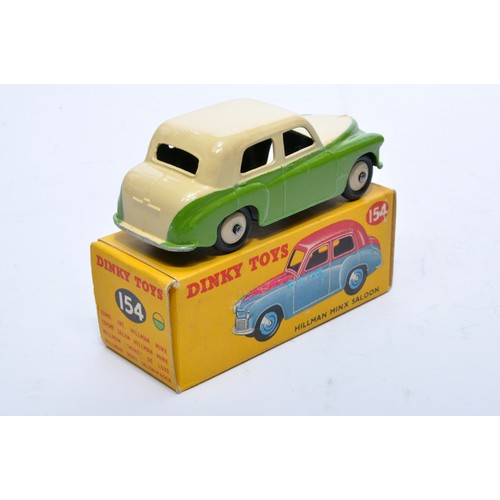 792 - Dinky No. 154 Hillman Minx Saloon. Single issue is in two-tone green and cream, with cream hubs, as ... 