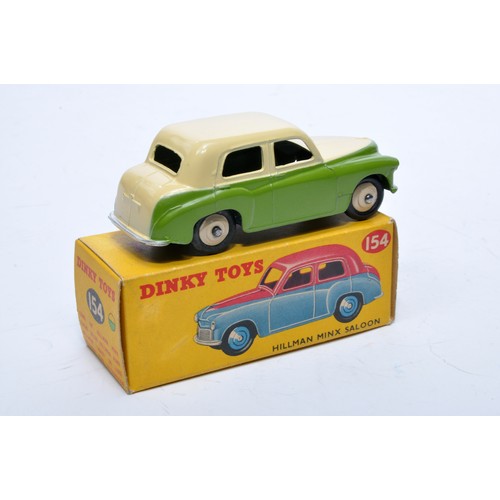 794 - Dinky No. 154 Hillman Minx Saloon. Single issue is in two-tone green and cream, with cream hubs, as ... 