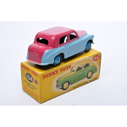 795 - Dinky No. 154 Hillman Minx Saloon. Single issue is in two-tone cerise and light blue, with mid-blue ... 