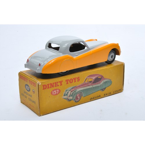 807 - Dinky No. 157 Jaguar XK120 Coupe. Single issue is in two-tone yellow and grey, with grey hubs, as sh... 