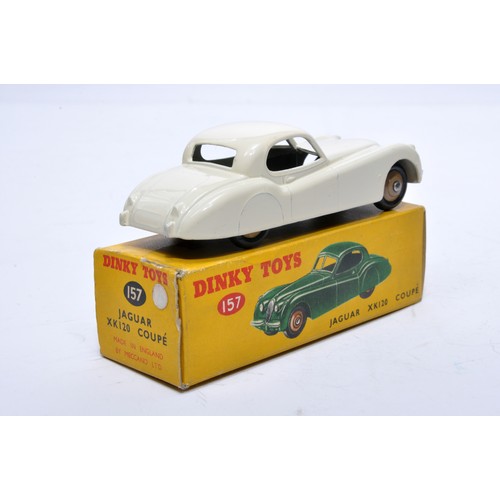 809 - Dinky No. 157 Jaguar XK120 Coupe. Single issue is in off-white, with dark fawn hubs, as shown. Displ... 