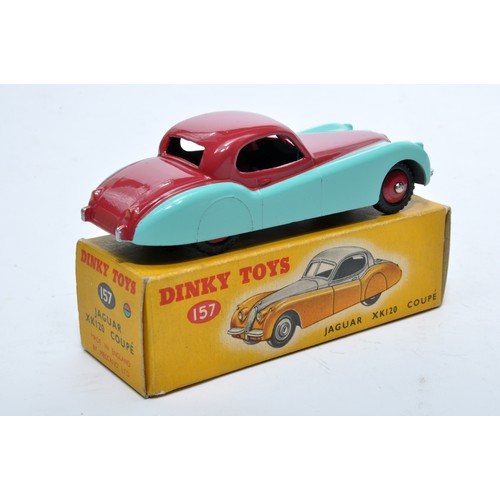 810 - Dinky No. 157 Jaguar XK120 Coupe. Single issue is in two-tone cerise and blue, with red hubs (treade... 