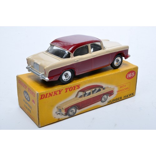 833 - Dinky No. 165 Humber Hawk. Single issue is in two-tone cerise and cream, with chrome hubs, as shown.... 