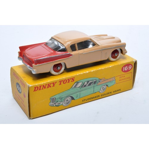 842 - Dinky No. 169 Studebaker Golden Hawk. Single issue is in two-tone light brown and red, with red hubs... 