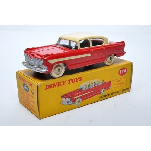 856 - Dinky No. 174 Hudson Hornet Sedan. Single issue is in two-tone cream and red, with cream hubs, as sh... 