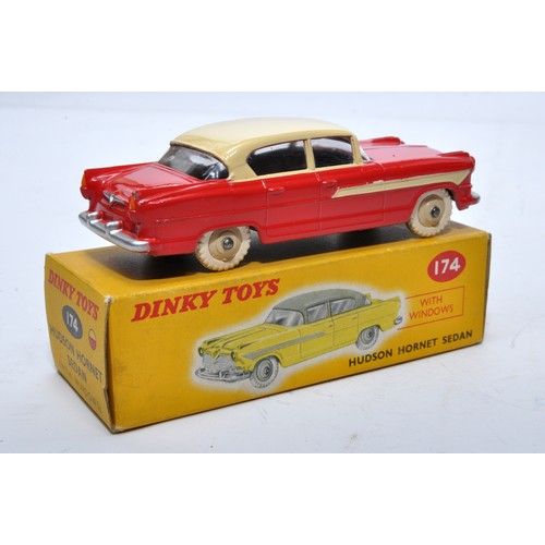 856 - Dinky No. 174 Hudson Hornet Sedan. Single issue is in two-tone cream and red, with cream hubs, as sh... 