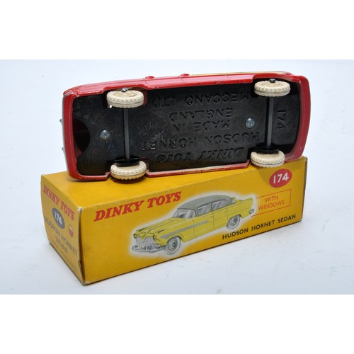 856 - Dinky No. 174 Hudson Hornet Sedan. Single issue is in two-tone cream and red, with cream hubs, as sh... 