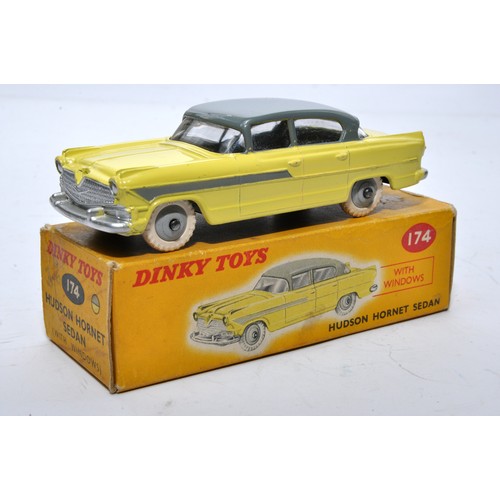 857 - Dinky No. 174 Hudson Hornet Sedan. Single issue is in two-tone grey and yellow, with grey hubs, as s... 