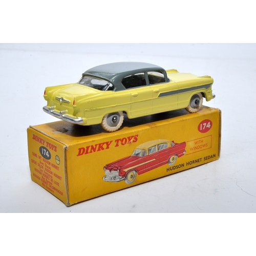 857 - Dinky No. 174 Hudson Hornet Sedan. Single issue is in two-tone grey and yellow, with grey hubs, as s... 