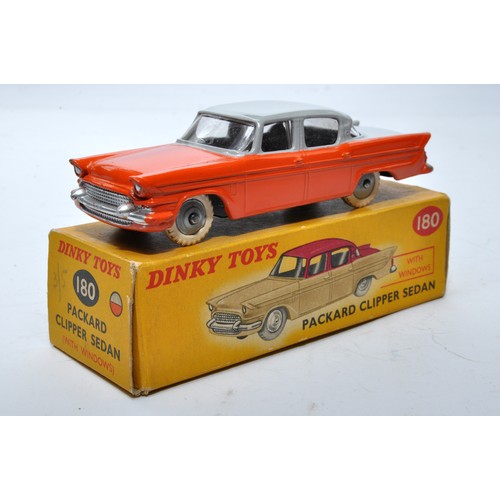 868 - Dinky No. 180 Packard Clipper Sedan. Single issue is in two-tone grey and orange, with grey hubs, as... 