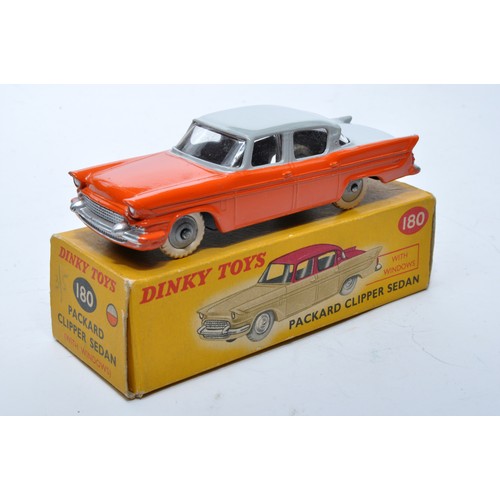 868 - Dinky No. 180 Packard Clipper Sedan. Single issue is in two-tone grey and orange, with grey hubs, as... 