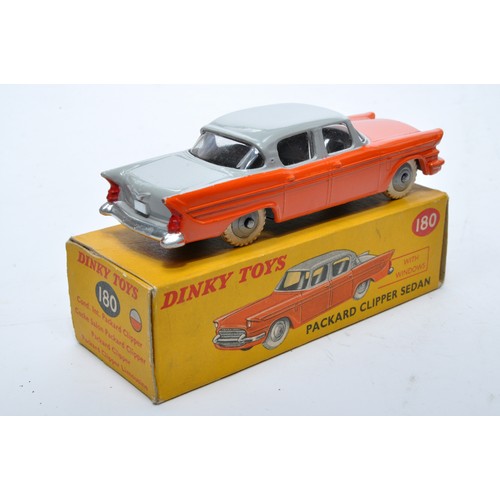 868 - Dinky No. 180 Packard Clipper Sedan. Single issue is in two-tone grey and orange, with grey hubs, as... 