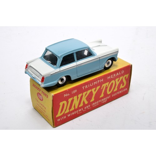 877 - Dinky No. 189 Triumph Herald. Single issue is in two-tone white and blue, with chrome hubs, as shown... 