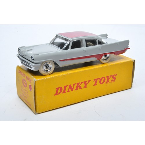 881 - Dinky No. 192 De Soto Fireflite Sedan. Single issue is in two-tone grey and red, with chrome hubs, a... 