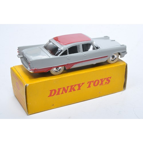 881 - Dinky No. 192 De Soto Fireflite Sedan. Single issue is in two-tone grey and red, with chrome hubs, a... 