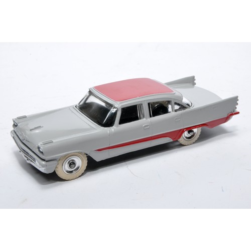 883 - Dinky No. 192 De Soto Fireflite Sedan. Single issue is in two-tone grey and red, with chrome hubs, a... 