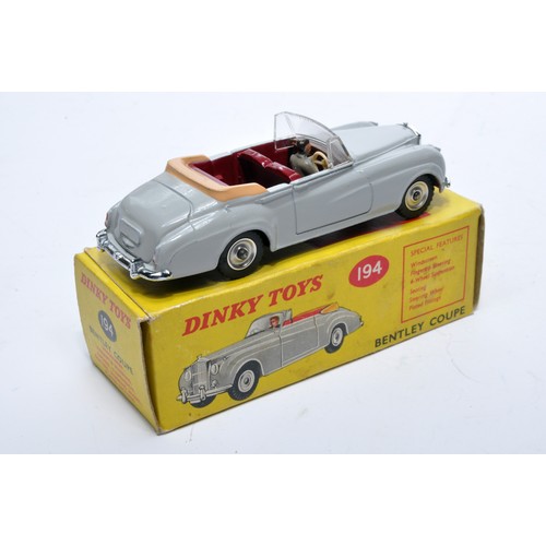 884 - Dinky No. 194 Bentley Coupe. Single issue is in grey with maroon interior, with chrome hubs, as show... 