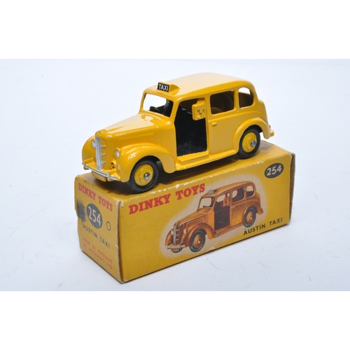 899 - Dinky No. 254 Austin Taxi. Single issue is in yellow, with yellow hubs, as shown. Displays generally... 