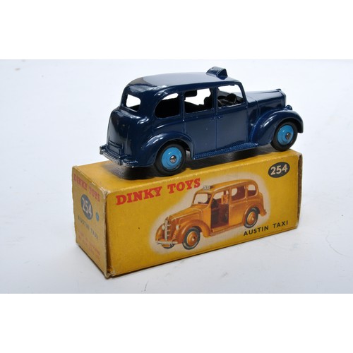 900 - Dinky No. 254 Austin Taxi. Single issue is in dark blue, with blue hubs, as shown. Displays generall... 