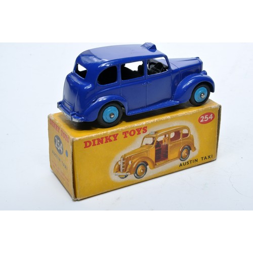 901 - Dinky No. 254 Austin Taxi. Single issue is in petrol blue, with blue hubs, as shown. Displays genera... 