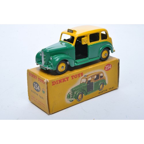 902 - Dinky No. 254 Austin Taxi. Single issue is in two-tone yellow and green, with yellow hubs, as shown.... 