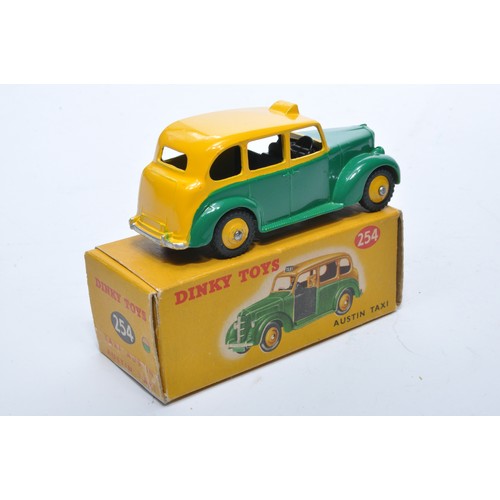 902 - Dinky No. 254 Austin Taxi. Single issue is in two-tone yellow and green, with yellow hubs, as shown.... 