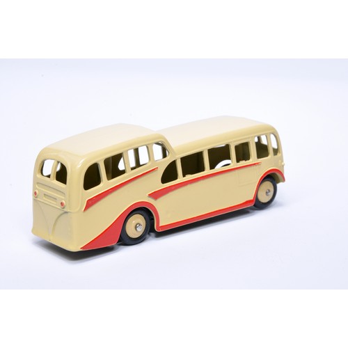 911 - Dinky No. 280 Observation Coach. Single issue is in cream, with red flashes, and cream hubs. Display... 