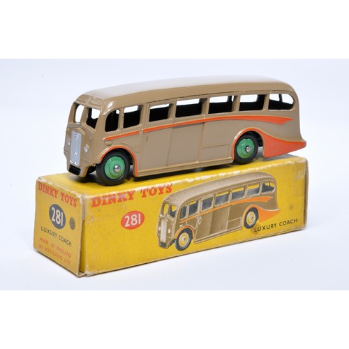 914 - Dinky No. 281 Luxury Coach. Single issue is in dark fawn, with orange flashes, and green hubs. Displ... 