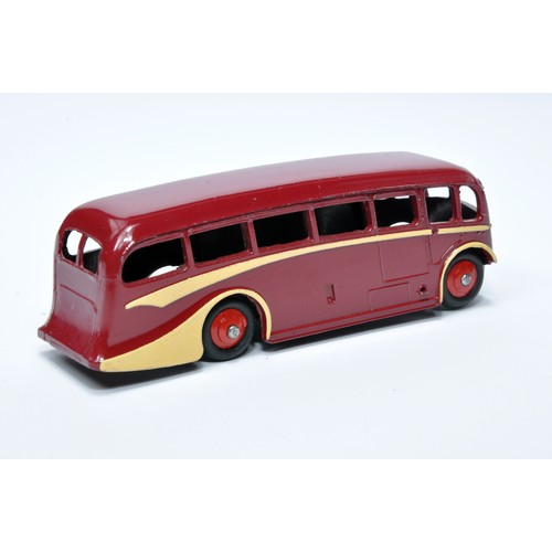 918 - Dinky No. 281 Luxury Coach. Single issue is in maroon, with cream flashes, and red hubs. Displays ge... 