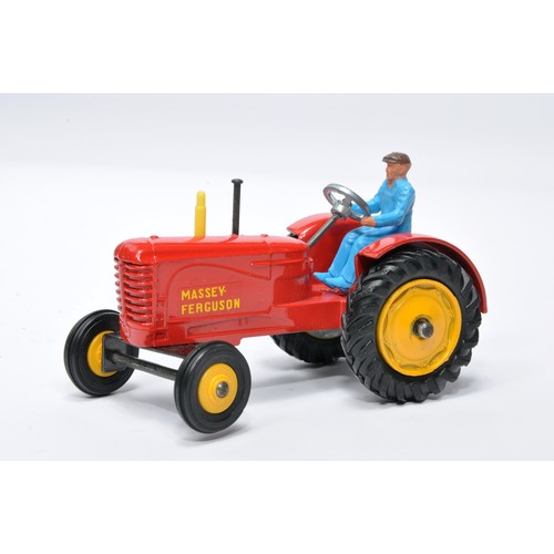 929 - Dinky No. 300 Massey Ferguson Tractor. Single issue is in red, yellow hubs, and rubber tyres, as sho... 