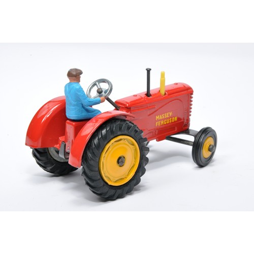 929 - Dinky No. 300 Massey Ferguson Tractor. Single issue is in red, yellow hubs, and rubber tyres, as sho... 