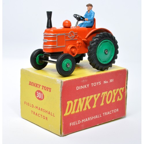 930 - Dinky No. 301 Field Marshall Tractor. Single issue is in orange, with green hubs, and rubber tyres, ... 