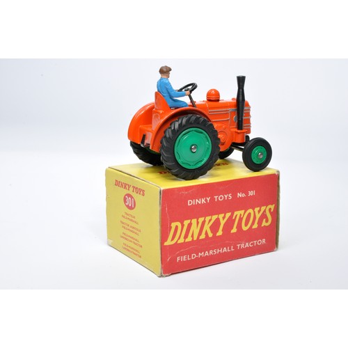 930 - Dinky No. 301 Field Marshall Tractor. Single issue is in orange, with green hubs, and rubber tyres, ... 