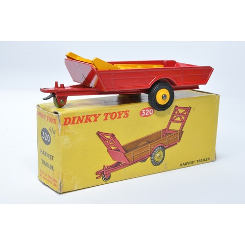 933 - Dinky No. 320 Harvest Trailer Single issue is in red, with yellow plastic hubs, plus rubber tyres,as... 