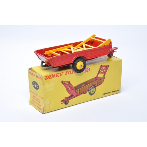 933 - Dinky No. 320 Harvest Trailer Single issue is in red, with yellow plastic hubs, plus rubber tyres,as... 