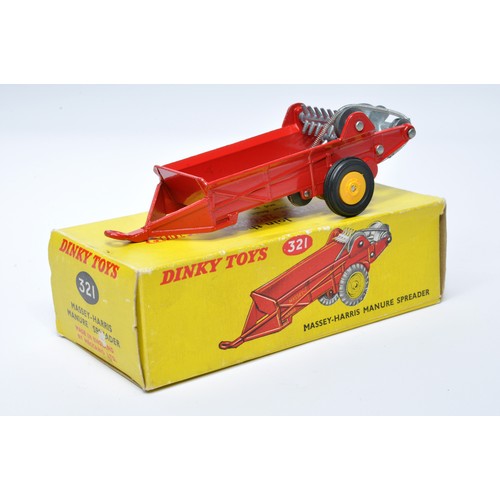 934 - Dinky No. 321 Massey Harris Manure Spreader. Single issue is in red, with yellow plastic hubs, plus ... 