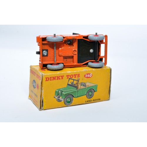 935 - Dinky No. 340 Land Rover. Single issue is in orange, with green interior, and red ridged hubs, as sh... 